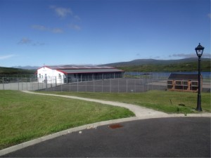 Lakeside Kennels & Cattery, Dungloe, County Donegal, Ireland - showing kennel and cattery building, exercise area and lake in background
