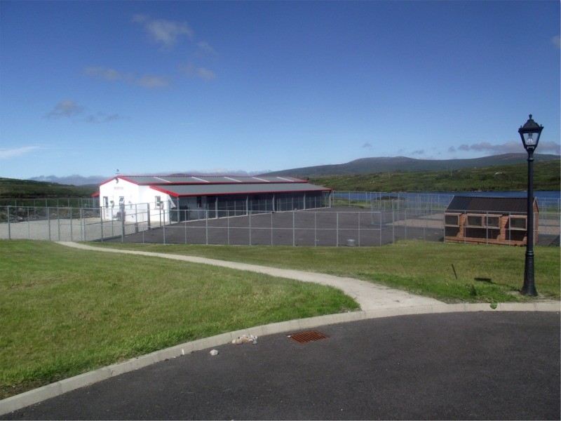 Lakeside Kennels & Cattery, Dungloe, County Donegal, Ireland - showing kennel and cattery building, exercise area and lake in background